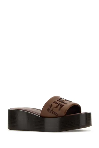 Fendi Women Brown Slides With Wedge Heel And Ff Motiv On The Band In Leather Man In Brown