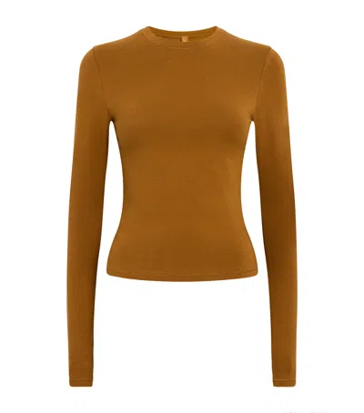 Skims Stretch Cotton Jersey Long Sleeve T-shirt In Brown