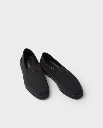 Prada Re-nylon Embossed Logo Slip-on Trainers In Animal Print