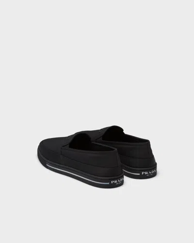 Prada Re-nylon Embossed Logo Slip-on Trainers In Animal Print