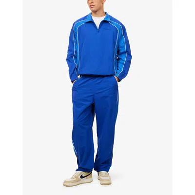 Awake Ny Mens Logo-embroidered Relaxed-fit Shell Track Bottoms Navy In Blue