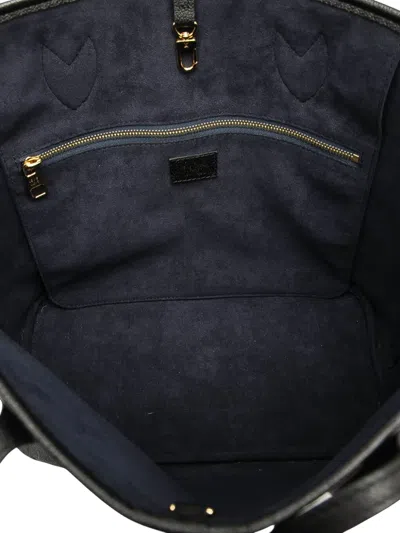 Pre-owned Louis Vuitton 2021-2025 Monogram Giant Empreinte Neverfull Mm Tote Bag In Black