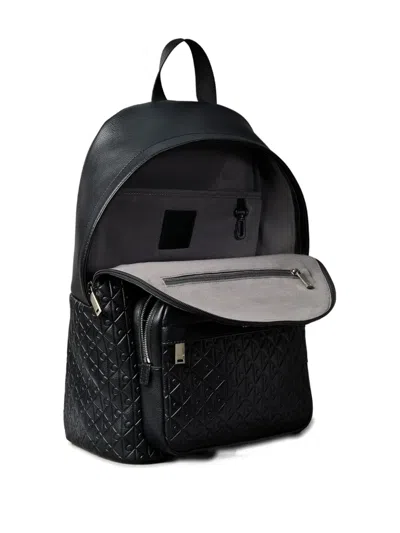 Calvin Klein Embossed Monogram Backpack In Black
