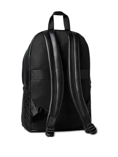Calvin Klein Embossed Monogram Backpack In Black
