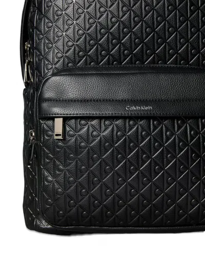 Calvin Klein Embossed Monogram Backpack In Black