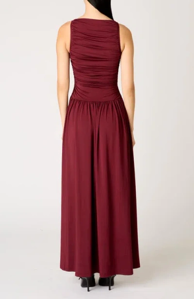 Nia Clea Ruched Sleeveless Drop Waist Maxi Dress In Burgundy