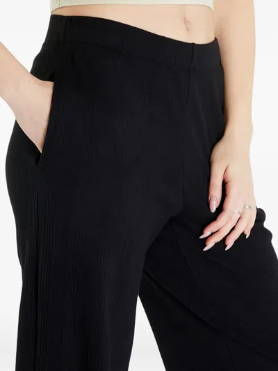 Calvin Klein Ribbed Side-pocket Trousers In Black