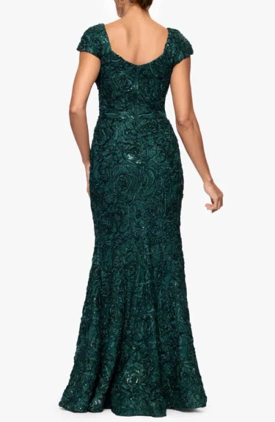 Xscape Evenings Asymmetric Neck Sequin Floral Mermaid Gown In Green