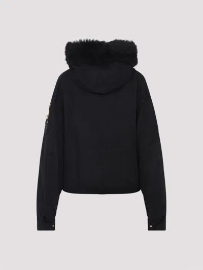 Moose Knuckles Fitted Hooded Jacket With Plush Fur Trim And Metallic Accents In Black