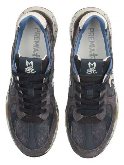 Premiata Low-top Sneakers With Graphic Text Accents In Blue