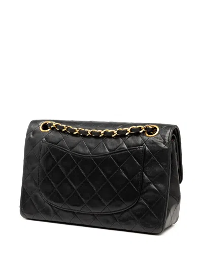 Pre-owned Chanel 1989-1991 Small Cc Quilted Lambskin Double Flap Shoulder Bag In Black