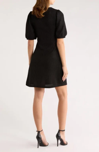 Area Stars Double Bow Puff Sleeve Sweater Dress In Black