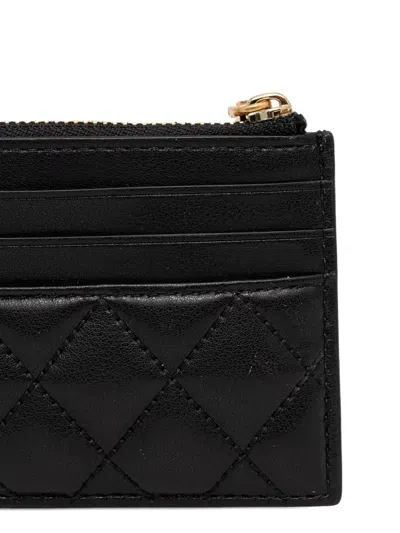 Dkny Logo-lettering Quilted Wallet In Black