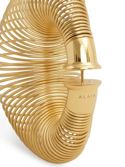 Alaïa Spiral Hoop Earrings In Gold