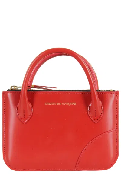 Comme Des Garçons Handles In Red