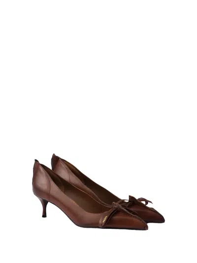 Prada Pumps In Antiqued Leather With Exposed Stitching And Raw Edges In Brown