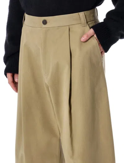 Studio Nicholson Pleat-detail Trousers In Brown