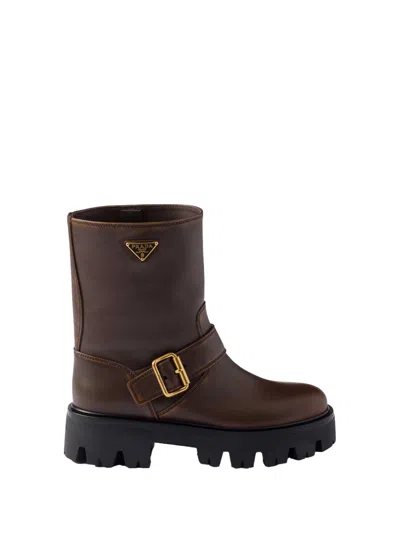 Prada Triangle Logo Distressed Leather Ankle Boots In Brown