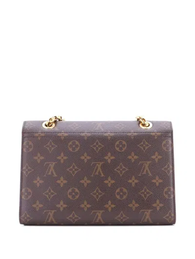 Pre-owned Louis Vuitton Victoire Handbag Monogram Canvas And Leather Shoulder Bag In Brown