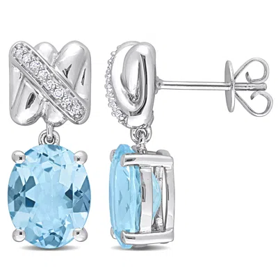Mimi & Max 7-5/8ct Tgw Oval-cut Sky Blue Topaz 1/10ct Tdw Diamond Earrings 14k White Gold In Blue