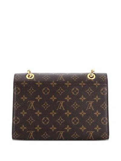 Pre-owned Louis Vuitton Victoire Handbag Monogram Canvas And Leather Shoulder Bag In Brown