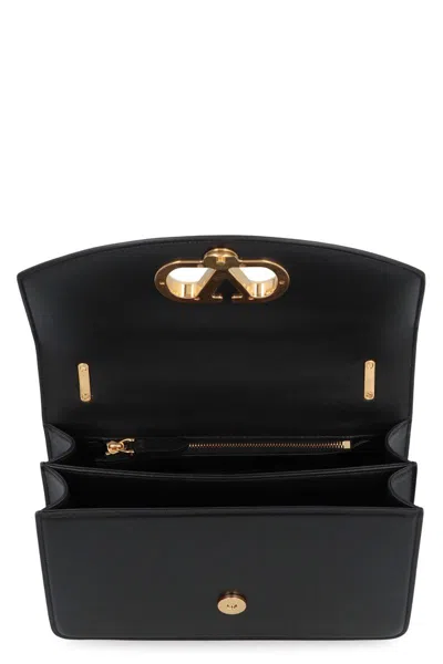 Valentino Garavani Vain Leather Shoulder Bag In Black