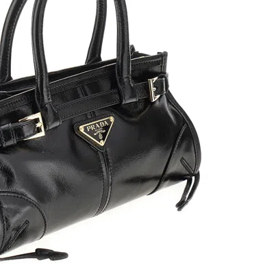 Prada Handheld Clutch With Buckle And Drawstring In Black