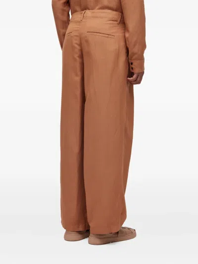 Osklen Pleated Linen Trousers In Brown