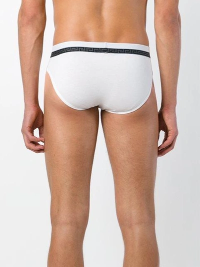 Shop Versace 'greca' Waistband Detail Briefs In White