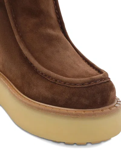 Prada Platform Booties Featuring Shearling Lining In Brown