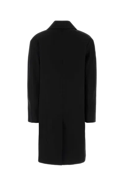 Saint Laurent Long Single-breasted Coat Featuring Side Pockets In Black