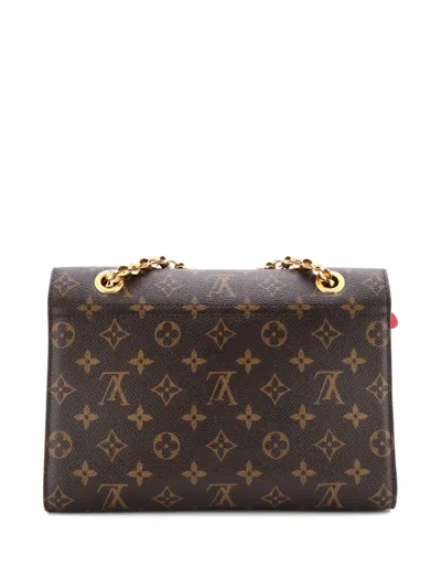 Pre-owned Louis Vuitton Victoire Handbag Monogram Canvas And Leather Shoulder Bag In Brown