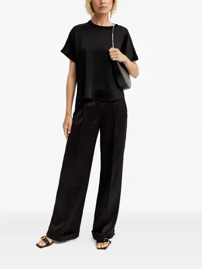 Nué Pleated Tailored Trousers In Black