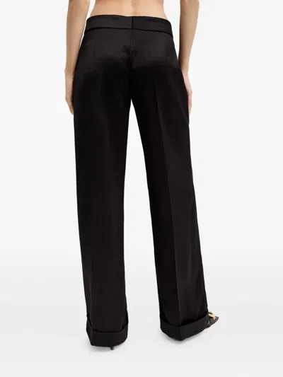 Nué Pleated Tailored Trousers In Black