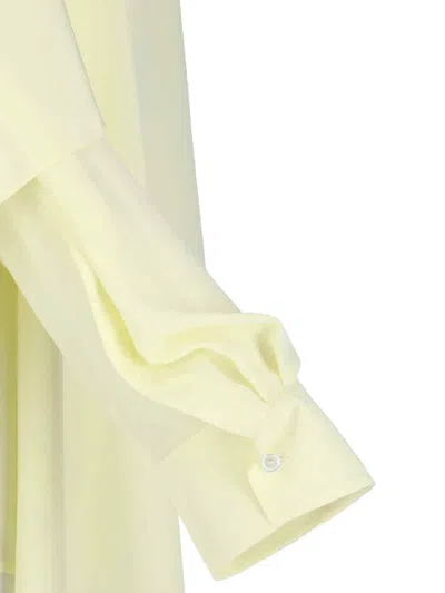 Calvin Klein Draped Long Sleeve Asymmetric Top With Buttons In Yellow