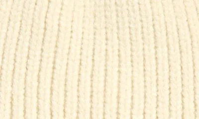 Tasha Faux Fur Pom Hat With Ear Flaps In Neutral