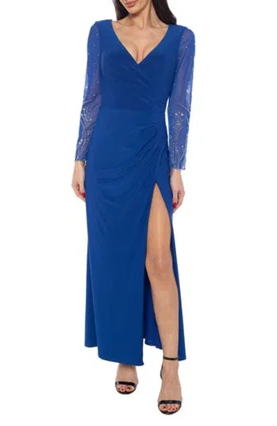 Marina Crystal Embellished Long Sleeve Faux Wrap Gown In Blue
