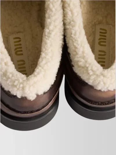 Miu Miu Bleached Leather And Shearling Penny Loafers In Animal Print