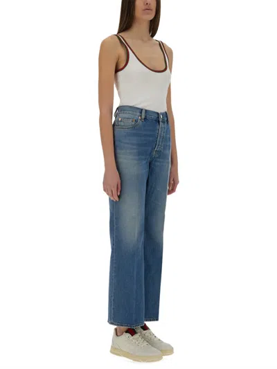Gucci Denim Pants With Logo Label In Blue