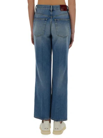 Gucci Denim Pants With Logo Label In Blue