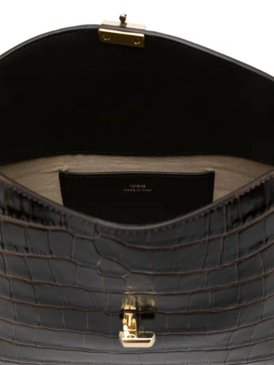 Totême T-lock Leather Clutch In Black