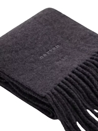 Carven Luxurious Wool Scarf Featuring Fringed Edges In Black