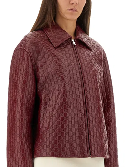 Gucci Women Oversized Leather Jacket With Embossed Gg In Red