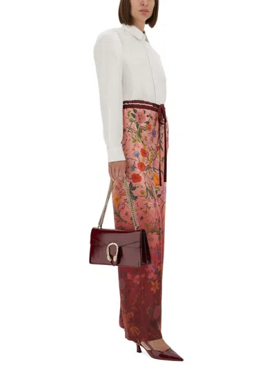 Gucci Women Bordeaux Pants With All-over Floral Print And Elastic Waist In Silk Woman In Multi