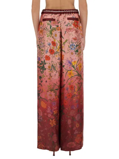 Gucci Women Bordeaux Pants With All-over Floral Print And Elastic Waist In Silk Woman In Multi