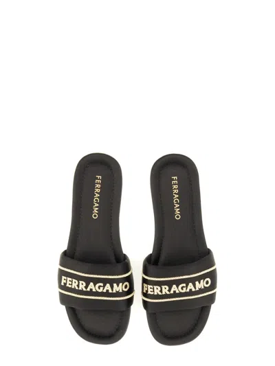 Ferragamo Logo Open Toe Flat Sole Sandal In Animal Print