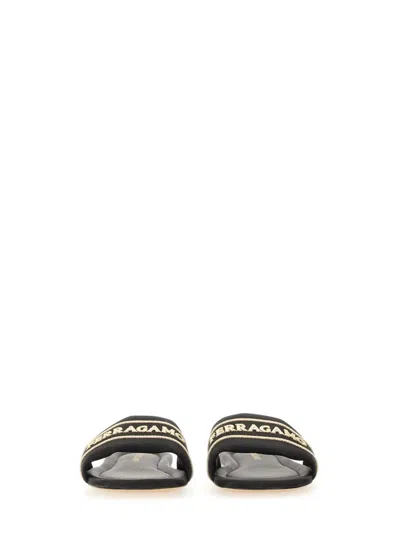 Ferragamo Logo Open Toe Flat Sole Sandal In Animal Print