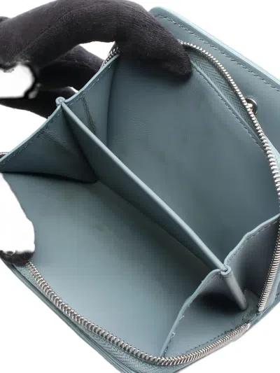 Pre-owned Louis Vuitton Embossed-monogram Zip Bi-fold Wallet In Blue