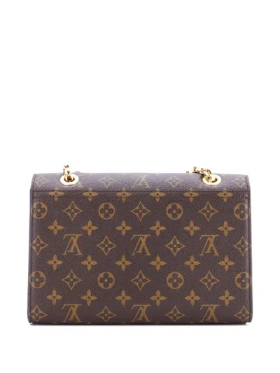 Pre-owned Louis Vuitton Victoire Handbag Monogram Canvas And Leather Shoulder Bag In Brown