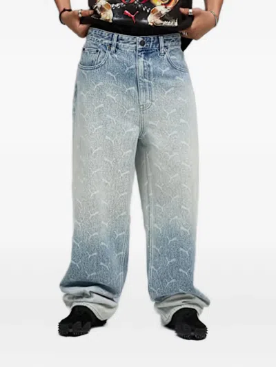 Puma Laser Monogram Denim Jeans In Blue